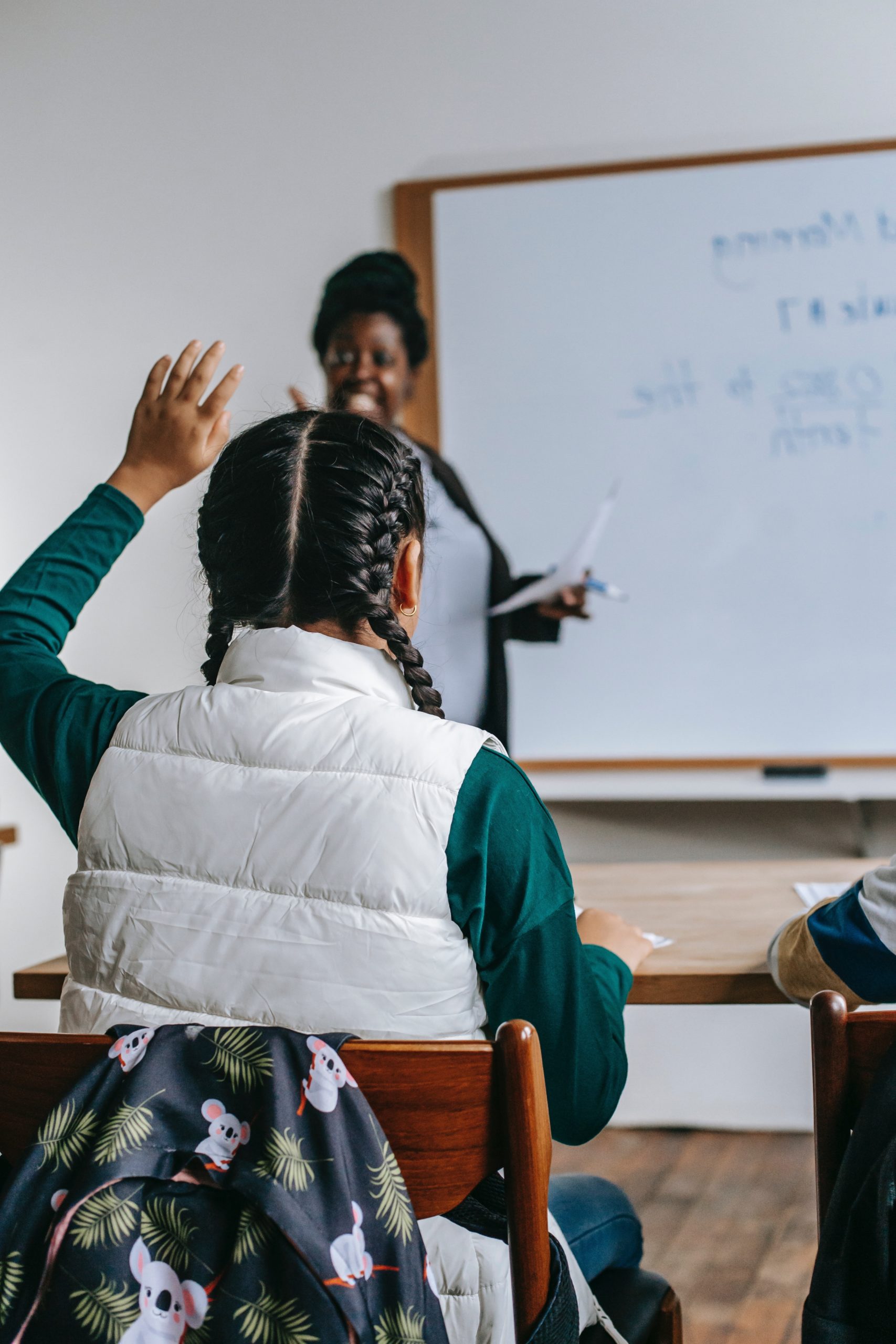 student raising hand